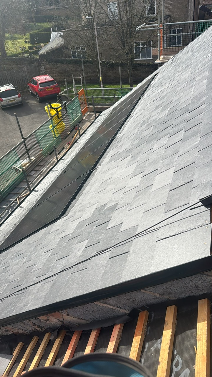 Slate roof alongside solar panels